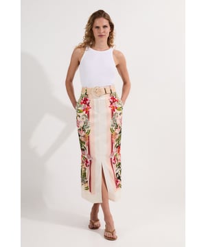 This Karen Millen midi skirt combines artistic flair with practical daywear appeal. The mirrored floral print creates a symmetrical pattern that draws the eye, while the front split adds a touch of contemporary charm. Style with a simple white tank top for casual gatherings, or pair with a crisp linen shirt and flat sandals for weekend brunches. The natural raffia belt creates a defined waistline and adds a touch of artisanal craftsmanship to the piece. For cooler evenings, layer with a lightweight denim jacket and switch to espadrilles for a relaxed yet put-together look. The versatile nature of this skirt makes it ideal for garden parties, seaside holidays or simply elevating your everyday wardrobe with its botanical-inspired design.  Striking mirrored floral print design Midi length with front split detail Raffia belt with circular buckle Practical side pockets Linen-viscose blend fabric