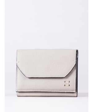 The Ings purse is a compact yet cleverly designed accessory, perfect for keeping your essentials neatly organised. Crafted from real leather, its dual-layered design offers both practicality and style.
The purse features a flapover front press-stud pocket, six card slots and a note slip pocket, as well as a rear expandable zip pocket for coins. Subtle foil branding elevates its look, while its versatile size makes it ideal for slipping into your handbag or carrying on its own.
Available in three timeless colourways, it pairs perfectly with the matching Ings grab bag for a coordinated, polished style.