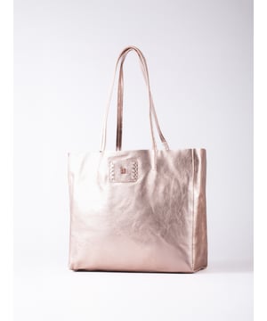 Effortlessly stylish with a relaxed silhouette, the Tarnly tote is your go-to for everyday ease. Crafted from supple leather in a slouchy bucket-bag style, Tarnly is designed to carry it all with understated elegance. The press-stud closure keeps things simple, while the brushed-finish interior highlights the natural beauty of the leather. A slip pocket provides quick-access storage, while the removable cloth inner bag&mdash;with a secure zip top&mdash;adds extra organisation when you need it. Spacious, versatile, and effortlessly chic, Tarnly is designed to carry it all with understated elegance.