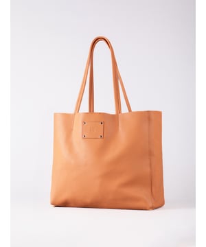 For relaxed leather luxury, look no further than the Tarn Bucket Bag in fresh apricot. This spacious tote style bag will effortlessly take you through the working week into the weekend with plenty of room for a laptop and notebooks or shopping if you&rsquo;re hitting the high street.
Crafted from real leather in a contemporary slouchy design, this bucket bag is fitted with a popper fastened top and conceals a handy inner cloth bag with zip top opening to keep your valuables extra safe. This cloth bag is securely clipped to a leather strap and is removable for ultimate versatility.