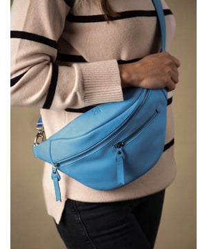 The Tarn Leather Sling Bag is a compact versatile style crafted from textured leather, designed for on-the-go. Boasting exterior zipped pockets as well as a main zipped compartment, there&rsquo;s plenty of places to organise your small essentials. The D-ring attachment on the comfy adjustable canvas strap allows you to easily wear this as a belt bag or cross body bag as you prefer. Adventure in style!