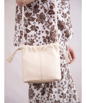 The Eskrigg Leather Drawstring Cross Body Bag combines contemporary style with compact practicality, making it the perfect everyday companion.
Crafted from luxurious real leather, this bag is designed for hands-free convenience with an adjustable cross-body strap for a tailored fit. The elegant drawstring closure, enhanced by a magnetic dot fastening, adds a touch of modern charm while keeping your essentials secure.
Inside, a fabric lining, zip pocket, and slip pocket provide thoughtful organization for smaller items. Compact yet versatile, this stylish cross-body bag is a sleek addition to the Eskrigg collection.