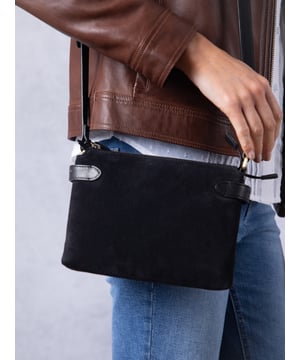 The Bridge twin cross body bag combines timeless style with practical design, making it a must-have for any wardrobe. Expertly crafted from real leather and suede, this versatile bag features a striking front suede compartment for added texture and interest. It also features an adjustable cross-body strap, offering a comfortable and customizable fit for hands-free wear.
With twin zip compartments &mdash; one smooth leather and one soft suede &mdash; there&rsquo;s ample space to keep essentials organized, while the interior slip pocket ensures smaller items stay secure. Finished with a ribbed fabric lining and available in three elegant colours, the Bridge bag is your go-to accessory for refined everyday style.