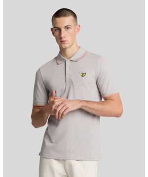 When people think of Lyle & Scott, they often think of polo shirts, so it stands to reason that we create the best polo shirts season after season. This one is cut for a classic fit in cotton jersey with a bit of added stretch and is finished with contrast tipping at the collar and cuffs for a slightly preppy look. - Classic collar 
- Front button fastening 
- Short sleeves 
- Tipped collar and cuffs
- Composition: 97% cotton, 3% elastane
