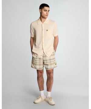 Introducing the Tartan Resort Swim Shorts, an exquisite addition to our spring menswear collection. Meticulously crafted from 100% premium polyester, these shorts embody sophistication and comfort, featuring a ribbed waistband with a drawcord for a personalized fit and inset side pockets for practicality. Completed with a distinguished golden embroidered eagle logo on the bottom leg, these swim shorts effortlessly blend style with functionality for the discerning gentleman.

- Material: 100% Polyester
- Fit: Regular
- Features: Ribbed waist band, drawcord, inset side pockets
- Logo: Golden embroidered eagle
- Versatile styling for resort transitions

Elevate your swimwear repertoire with the Tartan Resort Swim Shorts, a refined choice for the discerning gentleman this spring.