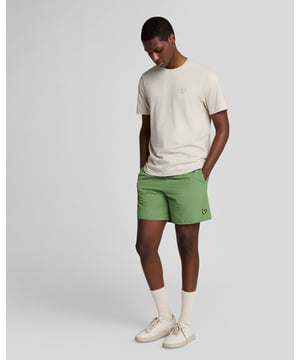 Finished with our signature Golden Eagle, these mesh-lined plain swim shorts, with fast-drying fabric, deliver the iconic Lyle & Scott style both in and out of the pool.
