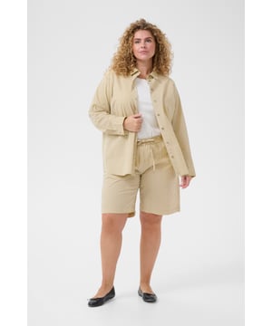 Loose fit,Elastische Taille,Mitte des Oberschenkels,Gerade  30° waschbar, Nicht bleichen, Trocknen im Trockner schonend, Tropnass aufhängen im Schatten, Warm bügeln max. 150° C, Trockenreinigung  100% Baumwolle