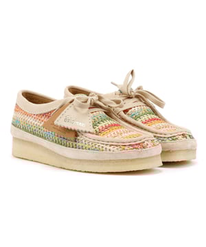 Moccasin style shoe featuring a multicolour crochet raffia upper for a handcrafted aesthetic. Designed with a natural pebble crepe sole for flexibility, natural flat laces, and a tonal suede rand for a refined finish.