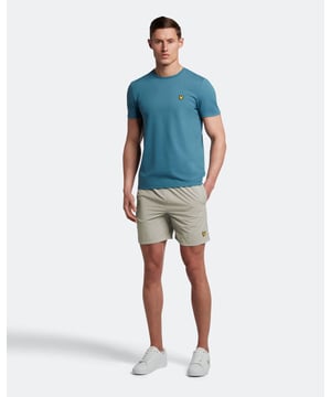 Finished with our signature Golden Eagle, these mesh-lined sports swim shorts, with fast-drying fabric, deliver the iconic Lyle & Scott style both in and out of the pool.\n- 100% polyamide- Elasticasted waist- Stitched eyelets- Stitched leg opening