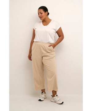 Loose fit,Elastische taille,Cropped lengte,Relaxed  Wassen op 30°, niet bleken, drogen in droger behoedzaam, Druipnat ophangen in de schaduw, warm strijken max. 150° C,   100% Katoen