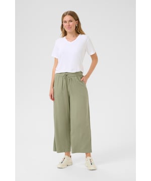 Loose fit,Elastische taille,Cropped lengte,Relaxed  Fijne was 30°, niet bleken, niet in de droger drogen, Druipnat ophangen in de schaduw, warm strijken max. 150° C,   70% Viscose (LivaEco™),30% Linnen