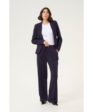 Regular fit,Elastische Taille,Lang,Weite leg  30° waschbar, Nicht bleichen, Nicht im Trockner trocknen, Tropnass aufhängen im Schatten, Kalt bügeln max. 110° C, Trockenreinigung  76% Polyester (Recycelt),20% Viskose,4% Elasthan