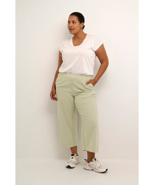Loose fit,Elastische taille,Cropped lengte,Relaxed  Wassen op 30°, niet bleken, drogen in droger behoedzaam, Druipnat ophangen in de schaduw, warm strijken max. 150° C, Droogreiniging  100% Katoen