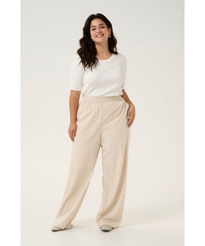 Loose fit,Elastische taille,Lange lengte,Relaxed  Fijne was 30°, niet bleken, niet in de droger drogen, Druipnat ophangen in de schaduw, koud strijken max. 110° C,   70% Viscose,30% Polyamide
