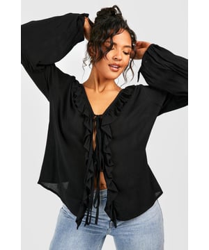 A certified wardrobe hero we can't live without, cause a storm this season in this plus size blouse from our latest collection. A smart, tailored style cut off above the waist to accentuate your curves, this floaty style can be dressed up or down, depending on the vibe. Want that 'jeans and a nice top' look? Wear a plus size white blouse with your high waisted denim and some chunky trainers and your weekend uniform is set. Detail is key with this one, that's why we're loving plus size ruffle blouses to add texture to an everyday look.Style: BlouseDesign: PlainFabric: CheeseclothLength: RegularNeckline: PlungeSleeve Length: Long Sleeve