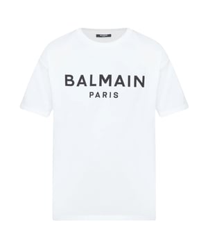 Elevate your wardrobe with the Balmain Paris Bold Brand Logo White T-Shirt, a statement piece that combines luxury and casual style effortlessly. Crafted from premium, soft cotton, this t-shirt ensures all-day comfort while showcasing the iconic Balmain logo boldly across the chest. Its crisp white colour offers versatile pairing options, making it perfect for both relaxed weekends and stylish outings. Designed for those who appreciate high fashion with a modern edge, this t-shirt adds a touch of Parisian sophistication to any outfit. Invest in timeless quality and standout style with this essential Balmain piece. 100% Cotton. Made In Italy. AH1EF000BB29 GAB
