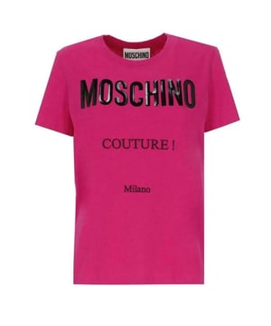 The Moschino Couture Gloss Logo Fuxia T-Shirt in vibrant pink is a bold addition to any modern man's wardrobe. Featuring the signature Moschino logo in a striking gloss finish, this T-shirt effortlessly blends luxury with street style. Crafted from high-quality materials, it ensures a comfortable fit that moves with you throughout the day. Whether paired with jeans for a casual look or layered under a jacket for a night out, this T-shirt makes a confident statement. Embrace standout style and showcase your fashion-forward attitude with this iconic Moschino piece. Made in Portugal, 100% Cotton