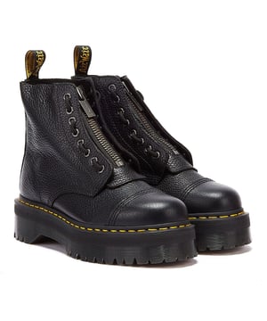 The Sinclair boots are part of DM's Quad collection, featuring an ultra-chunky Quad Retro double height sole and made with Aunt Sally, a naturally tumbled leather with a soft feel. Boasting two ways to fasten - laces and a zipper- , plus puritan stitching on the toe-cap and yellow stitching. Complete with signature DM's branding and scripted text heel-loop. • Platform height is 1.5', and heel height is 2' • Oil, Fat, Acid, Petrol and Alkali Resistant soles • Goodyear welt construction • Heat-sealing process and distinctive Air Wair 'Bouncing Soles'