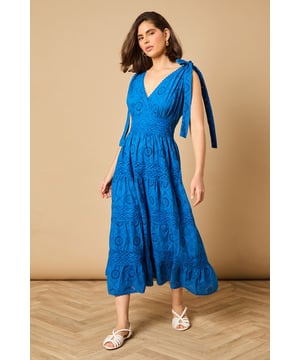 Intricate broderie anglaise detailing throughout for a feminine touch
        Flattering V-neckline at front and back for an elegant silhouette
        Charming tie shoulder straps that add a playful detail
        Tiered midi-length skirt with a relaxed, flowing shape
        Defined waistband that creates a beautifully structured fit
    
    This delightful broderie midi dress from Oasis captures effortless summer style with its feminine details and comfortable fit. The tie shoulders allow for a customised fit whilst adding a whimsical touch to the overall design. Perfect for daytime occasions, style with flat sandals as shown for a relaxed garden party or family lunch. For cooler days, layer with a lightweight denim jacket and trainers for a casual weekend look. The versatile design transitions beautifully from a countryside walk to an afternoon tea with friends. Accessorise with simple gold jewellery and a woven bag to complement the dress's intricate texture. The midi length offers both comfort and sophistication, making this a wardrobe staple that will see you through numerous casual events with ease and grace.