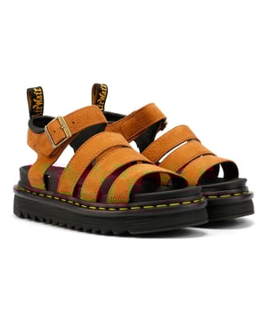 Discover these lightweight sandals crafted with Athena tumbled nubuck in a sleek 4-strap design, complete with adjustable branded buckles for a personalised fit. These sandals feature a Zebrilus sole made from super-lightweight EVA material, boasting a rugged ripple tread and signature DM's grooving for enhanced traction and durability. Finished with a convenient yellow scripted AirWair heel loop for easy wear.