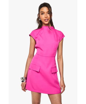 Structured woven fabric with textured finish for added dimension
        High neckline with cap sleeves for a sophisticated silhouette
        Figure-defining fitted waist that accentuates your shape
        Decorative pocket details at the hips for a modern twist
        Mini length perfect for showcasing your legs
    
    Make a statement in this head-turning mini dress from Boohoo. The high neckline and structured silhouette create a contemporary look that commands attention, whilst the textured fabric adds visual interest to this standout piece. Style with strappy heels and stacked bangles as seen on our model for a night out with the girls, or dress it down with white trainers and a denim jacket for daytime drinks. The versatile design works brilliantly for everything from cocktails at a trendy bar to birthday celebrations. The pocket details add a functional yet fashionable element to this already striking dress. Complete your look with a sleek ponytail and statement earrings to truly showcase this bold, party-ready number.