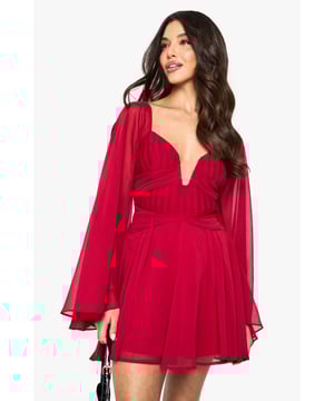 Dramatic long bell sleeves create a flowing, ethereal silhouette
        Striking plunge neckline adds a bold, confident touch
        Cross-back straps with tie detail for an eye-catching rear view
        Flattering gathered waist design enhances your figure
        Floaty chiffon fabric moves beautifully with every step
    
    Make a statement on your next night out with this show-stopping chiffon mini dress from Boohoo. The dramatic bell sleeves create movement and intrigue, while the daring plunge neckline ensures all eyes are on you. The cross-back design with delicate tie detail adds unexpected allure when you turn around. Style with strappy heels as seen on our model for a classic evening look, or add statement earrings to amplify the drama. Perfect for cocktail parties, club nights or special occasions where you want to command attention. The lightweight, flowing fabric creates a feminine silhouette that's both comfortable and captivating. This versatile piece transitions effortlessly from summer soires to autumn events when paired with the right accessories.