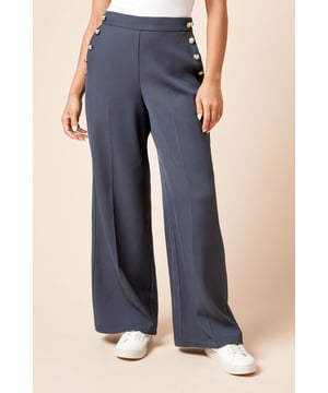 Striking military-inspired gold button detailing along the sides for a distinctive touch
        Flattering wide leg silhouette that creates a flowing, elegant line
        Smooth, comfortable waistband that sits perfectly at the natural waist
        Clean front design with no visible pockets for a sleek, uninterrupted look
        Versatile length that works beautifully with both flats and low heels
    
    These Dorothy Perkins Petite Military Button Detail Wide Leg Trousers blend contemporary styling with classic military-inspired elements. The decorative gold buttons along the sides add a touch of sophistication to the clean, flowing silhouette. Perfect for casual daywear, these trousers can be styled with a simple white top as shown for brunch with friends or family gatherings. The wide leg cut creates a graceful movement when walking, whilst the woven fabric offers just enough structure to maintain the elegant shape. Pair with trainers for a relaxed weekend look or dress up with ballet flats and a fitted blouse for baby showers. The versatile design makes these trousers an essential addition to your wardrobe, easily transitioning from casual coffee dates to more polished daytime occasions.