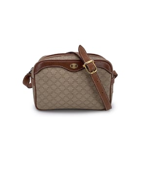 VINTAGE, RRP AS NEW
Embrace classic elegance with this beautiful vintage Celine small Macadam crossbody bag-a timeless piece that captures the charm of 1990s-era luxury. Expertly crafted from Celine's signature beige Macadam vinyl canvas and accented with light brown genuine leather trim, this compact silhouette is both chic and practical.  The bag features gold metal hardware that adds a touch of shine, while the adjustable leather shoulder strap ensures comfortable crossbody wear. An upper zipper closure opens to reveal a clean leather-lined interior, complete with a side zip pocket for your essentials.  Inside, the "Celine Paris" tag and Made in Italy stamp attest to its craftsmanship. Whether you're strolling through the city or dressing up your everyday look, this vintage Celine crossbody brings understated sophistication to every outfit Condition Rating: B - VERY GOOD CONDITIONCondition Details: Gently used. Some wear of use (scratches) leather trim and shoulder strap (especially on bottom corners). Some scratches on the internal lining. Please check the photos carefully and ask if you need to know more details or if you have any doubts.Measurements (cm):Depth: 7.6Height: 12.7Length: 19.1Other Details: Dustbag? NoKeys? NoBox? No Measurments:  width: 76 mm length: 191 mm height: 127 mm