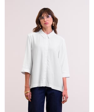 This flattering shirt features a slightly swing shape due to the deep box pleat detail at the back. With a curved hem, which is slightly longer at the back for more coverage, and cropped three-quarter-length sleeves with wide cuffs, the silhouette is clean and modern. The shirt collar, full-length button-through placket, and buttons made from Corozo nut complete the shirt.