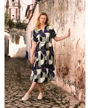 This versatile midi shirt dress features a collared V-neckline and grown-on sleeves with turnback cuffs, along with an easy-to-wear self-tie belt for adjustable styling. A wardrobe staple with a relaxed fit for every occasion.