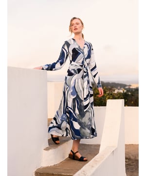 Made from a light and airy fabric that drapes beautifully, this button through midi dress has a full, flowing skirt. It can be tied at the front or back, and features a v-neckline with stand collar detailing, and long sleeves with cuff and button fastenings.