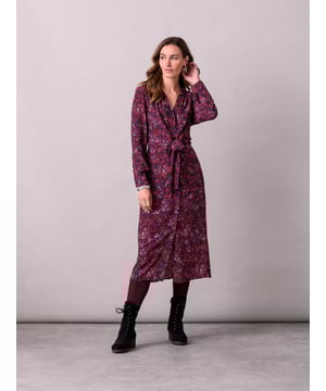 This midi shirt dress embodies our signature aesthetic, featuring a collared neckline and a flattering self-tie detail. With convenient side pockets, it offers a button-through closure crafted from a viscose blend, giving a flattering drape.Made in Romania.