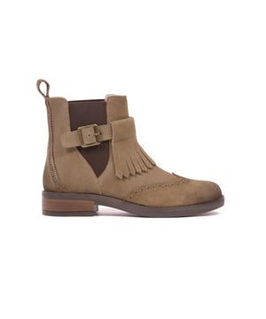 Our newest take on a classic Chelsea Boot is made with a suede upper with elasticated detailing. They feature a buckle and strap with clever fringe detail, which has been designed and manufactured so it can be removed and reattached, by slipping the fringe panel off and back onto the strap depending on the desired look. Along with brogue cut-out detail, these boots are unique with lots of character.