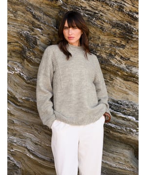 We're proud to say that from farm to factory our beautiful Gansey jumper is produced entirely in Britain. A take on the traditional fisherman’s Gansey jumper, we’ve been inspired by stitch patterns used historically in Cornish fishing villages. Details include a boxy, drop shoulder body shape with T sleeves and a ribbed and cast off rolled collar. Panelled stitch patterns run across the top half of the jumper, plus it is ‘knitted in the round’, meaning it is seamless, just as the traditional fisherman’s jumpers were made. Made using undyed wool, the natural fibres keep you warm in cold weather, but are breathable too.