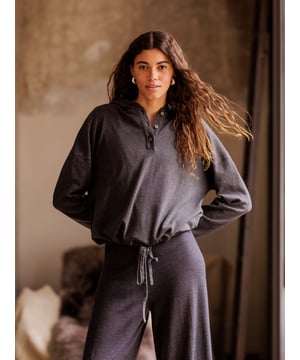 Pull up the cosy, double layered hood and snuggle down in comfort. Part of our lounge collection, this hooded jumper with long, warm sleeves is easy to style when both lounging at home or heading out. Designed to coordinate with the rest of the lounge collection range, details include a short button through placket on the front and drawstring hem detail with a tonal drawcord.