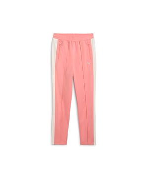 PRODUCT STORY: Step up your game with PUMA's slim track pants. Featuring T7 panel inserts, pintuck detailing, and zip pockets, these pants blend heritage and modernity. The elasticated waistband and tonal drawcords ensure a flawless fit, while the iconic logo adds a touch of legacy. DETAILS: Slim fit; Tricot; Regular length; Medium rise; Side Pocket; PUMA Youth: Recommended for older kids between 8 and 16 years.