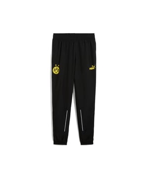 PRODUCT STORY: Show your love for the Black & Yellow with these pants featuring a BVB badge on the right leg and a PUMA Cat logo on the left. The zip pockets and internal drawcords ensure convenience, while flat mesh piping adds a modern touch. Perfect for cheering at Signal Iduna Park! FEATURES & BENEFITS: Made with at least 50% recycled materials. DETAILS: Regular fit; Plain weave material; Above knee length; Medium rise; Flat mesh piping on bottom back panel; Internal drawcords; Zip pockets; PUMA Cat logo on the mid left leg; BVB badge on the mid right leg.
