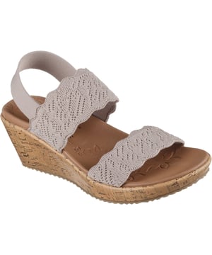 Tauchen Sie ein in die Welt von Komfort und Stil mit der Skechers Beverlee Keilsandale, einem Schuhwunder, das elegantes Design mühelos mit unvergleichlicher Unterstützung verbindet.