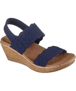 Stap in de wereld van comfort en stijl met de Skechers Beverlee wedge sandalen, een voetmodewonder dat moeiteloos chique ontwerp combineert met ongeëvenaarde ondersteuning.