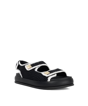 Hit the refresh button on your sandal selection and opt for Luffle. Crafted from textured fabric with contrasting piping, this open-toe style is sure to become a staple in your warm-weather wardrobe. Featuring double buckle details and a back heel strap for a secure fit, the flatform sole adds a modern, elevated edge to your look.