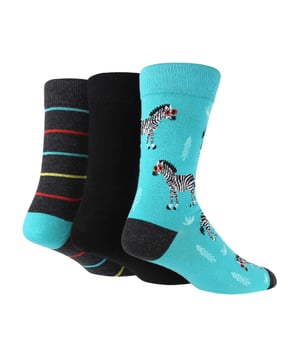 Mens Wild Feet 3 Pack Jacquard Socks: If you’re looking to add a pop of colour to your sock drawer but don’t want to sacrifice comfort, these Wild Feet Mens Socks are for you!. These Wild Feet socks are made with cotton fibres, making them very breathable and comfortable for all day wear! These socks would make for a great novelty gift. They come in a variety of designs and colours to suit all tastes, we think you’ll go wild for them! You’ll feel like the coolest cat around with the ‘Chilling Lion’ socks and our taco socks will have you feeling ‘Spec -Taco-lar’!. These range of socks come in a 3 pack and are made from 76% Cotton, 22% Polyamide and 2% Elastane. They are mens size 7-11 UK. They are also machine washable. Extra Product Details: Mens Wild Feet 3 Pack Jacquard Socks A Great Gift 10+ Styles to Choose From 3 Pair Pack Super Soft & Breathable Cotton Rich Machine Washable Under 40°