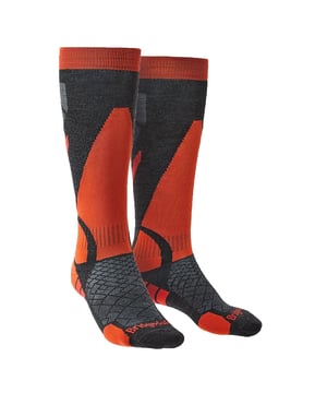 Men's Performance Lightweight Ski Socks: Hit the slopes with the unrivaled comfort and innovative design of our Performance Lightweight Ski Socks. Crafted for a snug fit that keeps up with every twist and turn, these over-the-calf MerinoFusion™ socks accommodate a seamless transition from powder runs to apres-ski activities. Tailored for skiers of all levels, they offer a wrinkle-free experience with the Men's Precision Fit System, incorporating LYCRA® for a supremely supportive feel. With care, our ski socks merge premium Tactel® shin pads to reduce friction and micro-terry underfoot pads to cushion every step. Their lightweight composition doesn't compromise on warmth or comfort, making them perfect for any winter adventurer. The Performance Lightweight Ski Socks shine with exceptional features. Their Moisture Management system ensures feet stay dry, while ThermoFit keeps the cold at bay. The flat toe seam and ShockZones offer comfort and protection where it counts, and the Y-Heel design keeps the sock firmly in place. Slide into performance wear that moves with you and supports your alpine pursuits. Distinct Features: - Performance Fit - Strategic Cushioning - Superior Moisture Wicking - Thermo-regulating Fit - Smooth Flat toe seam - Reinforced ShockZones - Unique Y-Heel construction - Suitable for on and off piste - Ideal for ski touring - LYCRA® for a secure fit"