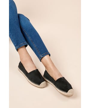 Faux suede espadrille flats with traditional rope-wrapped sole for authentic Mediterranean charm
        Slip-on design with elasticated inserts for easy wear and comfortable fit
        Flat heel height (under 2cm) ideal for all-day comfort without sacrificing style
        Classic round toe silhouette that pairs effortlessly with casual and smart-casual outfits
        Textured outsole providing reliable grip for everyday wear
    
    The Catarina Espadrille Flats bring timeless Mediterranean style to your everyday wardrobe. These versatile slip-ons feature the distinctive rope-wrapped sole that characterises traditional espadrilles, whilst the soft faux suede upper adds a touch of sophistication. Perfect for casual brunches with friends or family gatherings, they pair beautifully with cropped jeans as shown, or with floaty summer dresses and midi skirts. The comfortable flat design makes them ideal for city exploring or garden parties where you'll be on your feet all day. Their understated elegance works wonderfully for those occasions when you want to look polished without the discomfort of heels. A Dorothy Perkins staple that will see you through multiple seasons with effortless style.