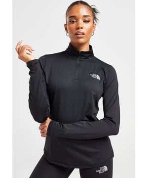 The North Face Women's Never Stop Exploring Top is a must-have. - - . This top is cut from smooth, stretchy recycled poly fabric for ultimate comfort. - - . It features a 1/4 zip fastening with a durable collar for custom coverage. - - .  It's stamped with TNF branding at the chest and back. - - .  Machine washable. Model is 5'8" and wears a size S.