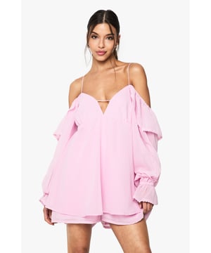 Chiffon fabric for a light and airy feel
        Cold shoulder design with ruffle detailing
        Plunging V-neckline for a daring look
        Voluminous long sleeves with gathered cuffs
        Playsuit silhouette for effortless style
    
    Make a statement at your next special occasion with this enchanting chiffon playsuit from Boohoo. The cold shoulder design with ruffle accents adds a touch of romance, while the plunging V-neckline creates an alluring focal point. The voluminous long sleeves with gathered cuffs balance the short length, offering a perfect blend of coverage and flirtation. Ideal for formal events, weddings, or a night out on the town, this playsuit can be dressed up or down to suit your style. Pair it with strappy heels and a clutch for a sophisticated ensemble, or dress it down with flat sandals for a more casual yet chic look. The versatile design ensures you'll stand out in the crowd, embodying the fun and trendy spirit that Boohoo is known for.