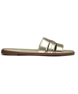Sandalias Cole Haan Flynn doradas para mujer, fabricadas en piel y suela sintética. Incluyen: parte superior de piel y plantilla acolchada.