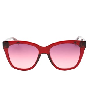 Calvin Klein Cherry Red Sunglasses combine bold style with sophisticated design, perfect for making a statement wherever you go. Featuring a striking cherry red frame and mauve gradient lenses, these sunglasses offer both eye-catching color and subtle shading to protect your eyes from harsh sunlight. Crafted for women who appreciate fashion and function, they provide a comfortable fit and durable quality that lasts. Elevate your look with these iconic Calvin Klein sunglasses, designed to complement any outfit while ensuring you stay stylish and shielded all day long. 100% Plastic, 54x17x140