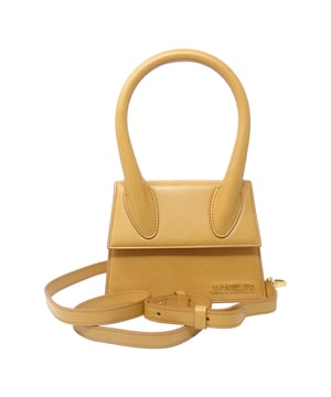 Discover the Jaquemus Le Chiquito in elegant beige, a compact yet striking leather bag designed for women who appreciate style and sophistication. Crafted from 100% leather, this bag offers durability alongside a chic, minimalist look. Its petite size makes it perfect for carrying essentials while adding a refined touch to any outfit. Elevate your accessory collection with this timeless piece that blends practicality with Parisian flair, ideal for both day and evening occasions
