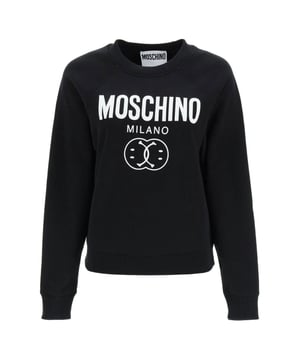 Elevate your wardrobe with the Moschino Milano Double Smiley Black Jumper, a perfect blend of bold style and comfort. Crafted with premium materials, this jumper features the iconic double smiley design that adds a playful yet sophisticated touch to your look. Its sleek black color makes it versatile for both casual outings and stylish events. Experience warmth and softness without compromising on fashion, making it an essential piece for those who want to stand out effortlessly. Upgrade your collection with this statement jumper that combines Moschino's signature creativity and quality. Made in Portugal, 100% Cotton