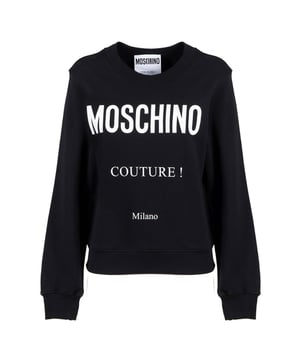 Elevate your wardrobe with the Moschino Couture Milano Black Jumper, a perfect blend of luxury and comfort. Crafted with premium materials, this jumper offers a sleek black design that effortlessly complements any outfit. Its refined fit and subtle detailing showcase Moschino's signature style, making it ideal for both casual and sophisticated occasions. Experience warmth and elegance in one versatile piece that enhances your everyday look with a touch of Italian couture flair. Make a statement with this timeless jumper that promises durability and fashion-forward appeal season after season. Made in Portugal, 100% Cotton